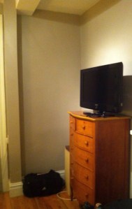 The wasted corner (pic from when we first moved in, the crate was where the bag is)